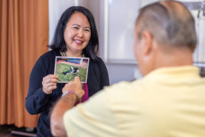 A therapist helping a resident at Whitney Oaks