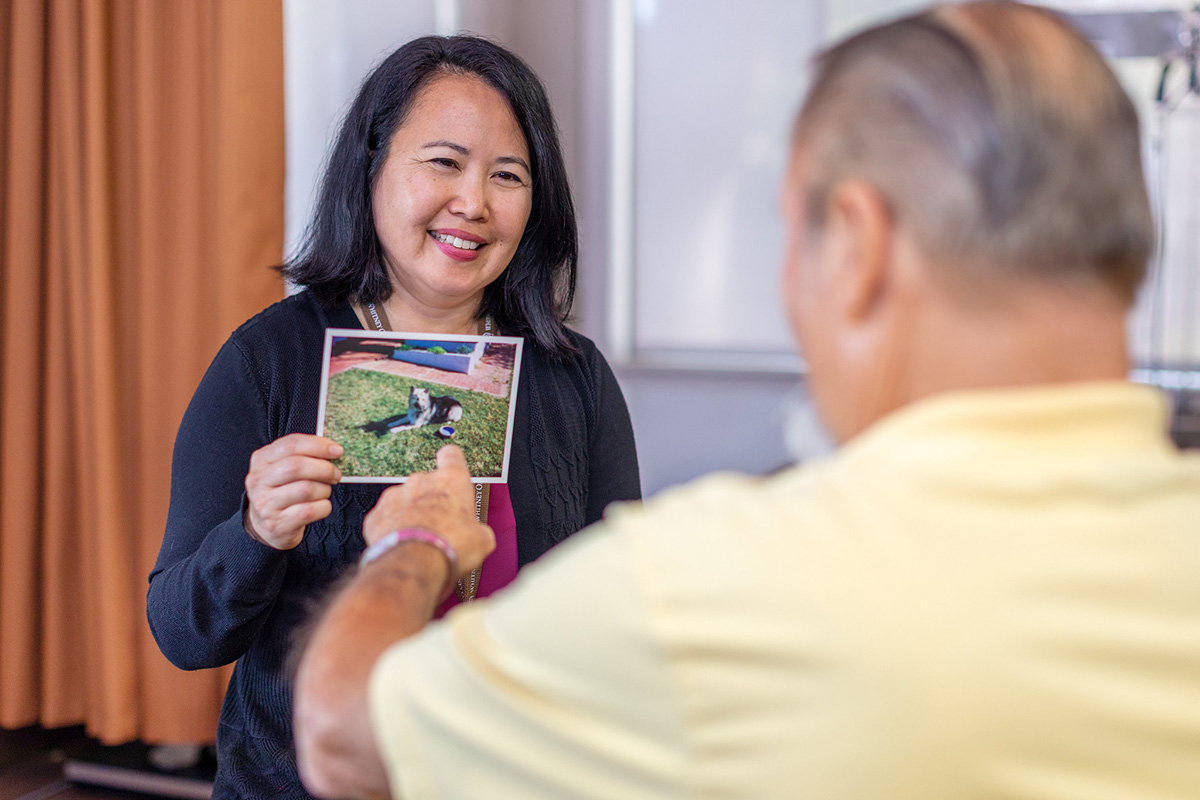 A therapist helping a resident at Whitney Oaks